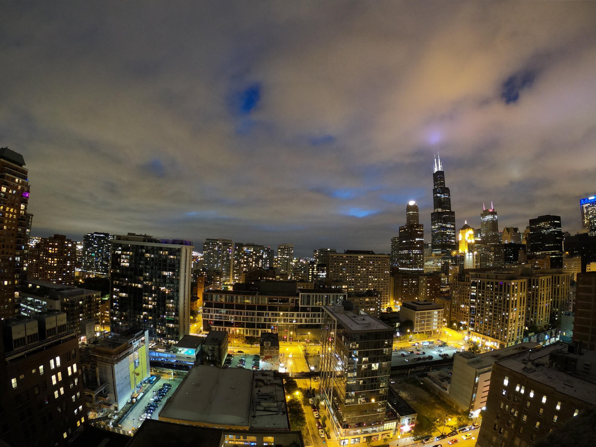 A distorted image of the Chicago skyline. The buildings towards the edge of the image have curved edges and obvious lens distortion artefacts.